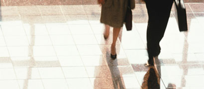 Businessman and businesswoman walking (h)